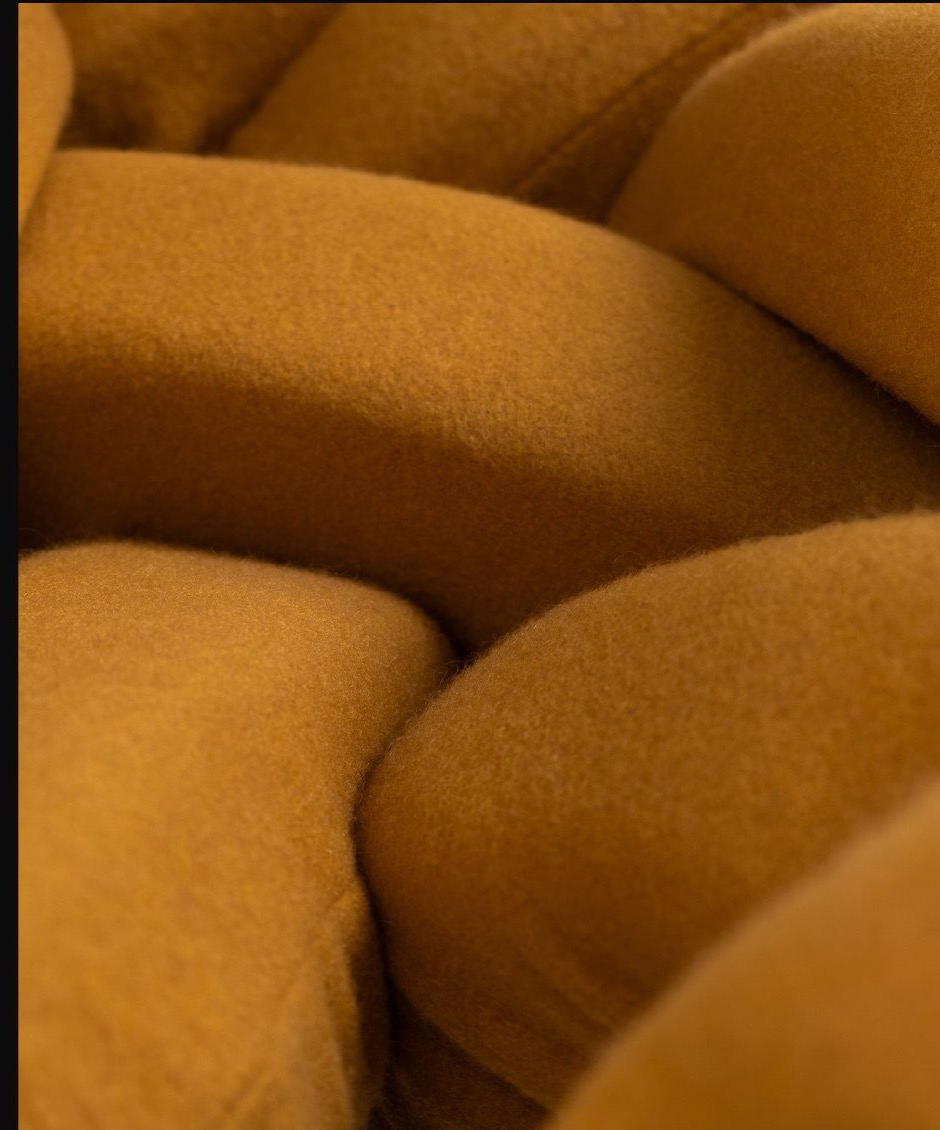 WIG — hand-sewn fabric-tube upholstery detail